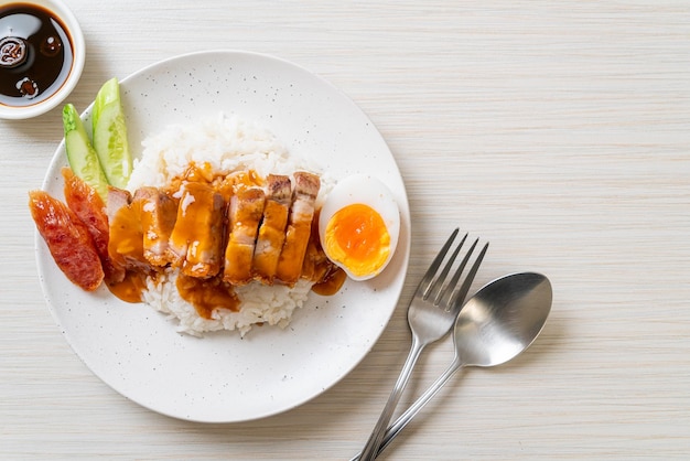 crispy belly pork on rice with barbecue red sauce