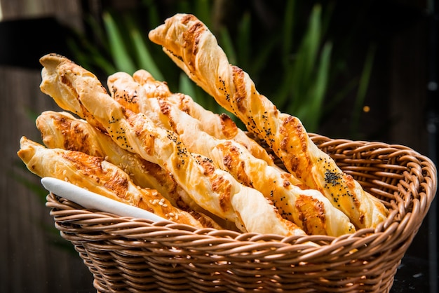 Crispy bread sticks on old wooden table.