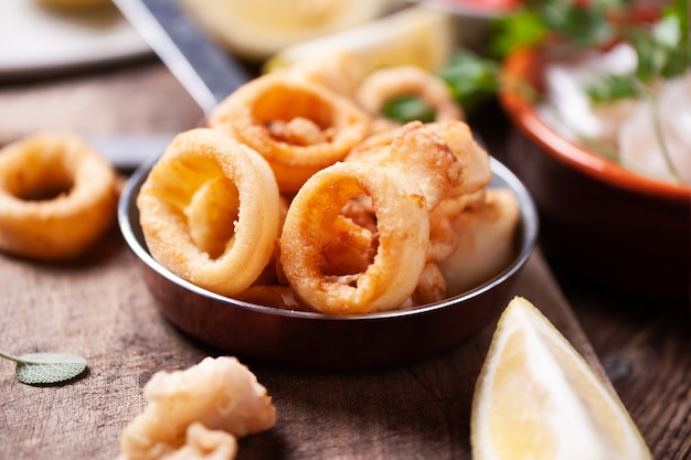 Crispy calamari rings on a rustic table