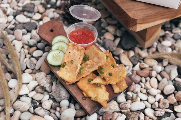 Crispy chicken egg and  tempe with cumcumber and chili sauce