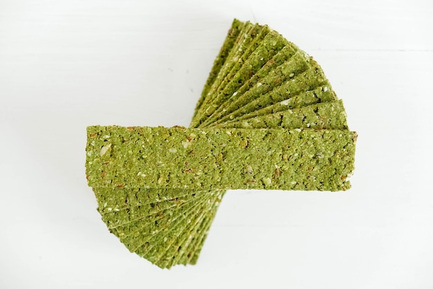 Crispy chips with kelp and spirulina on a white background