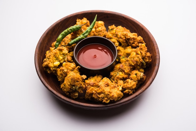 Crispy Corn pakora or pakoda, bhajji, Bhaji, bajji or pattice . served with tomato ketchup