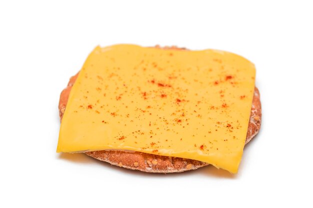 Crispy cracker sandwich with cheese and paprika  isolation