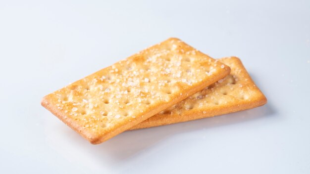 Crispy crackers on white background