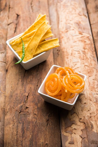 Crispy Fafda with sweet jalebi is an Indian snack most popular in Gujarat, selective focus