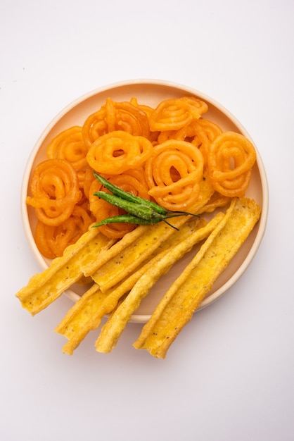 Crispy Fafda with sweet jalebi is an Indian snack most popular in Gujarat, selective focus