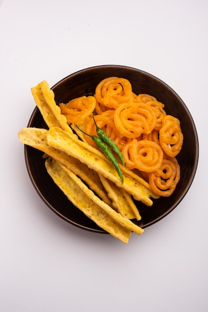 Crispy Fafda with sweet jalebi is an Indian snack most popular in Gujarat, selective focus