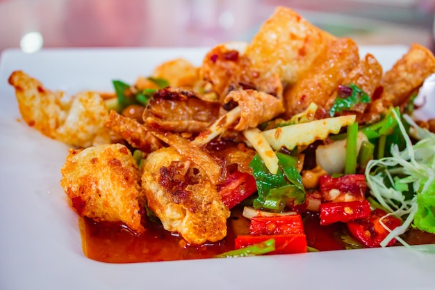 Crispy fish maw in spicy salad.