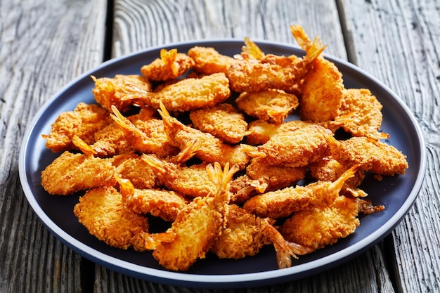 Crispy Fried Butterfly Shrimp on a grey plate