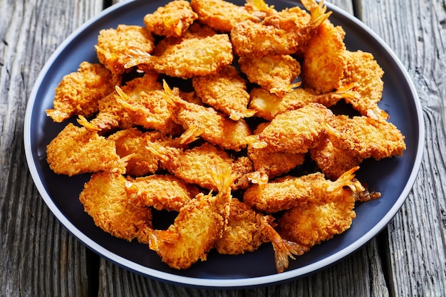 Crispy Fried Butterfly Shrimp on a grey plate