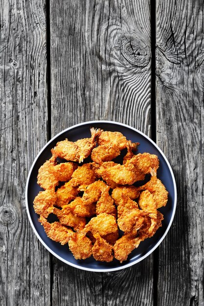 Crispy Fried Butterfly Shrimp on a grey plate