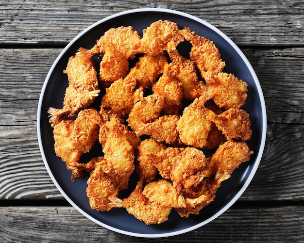 Crispy Fried Butterfly Shrimp on a grey plate