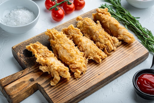 Crispy fried chicken broast cuts on white background.