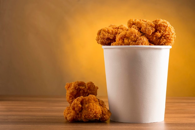 fried chicken bucket | Photo the Premium chicken in bucket Crispy