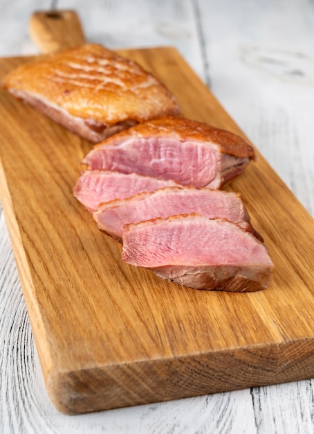 Crispy fried duck breast on the cuttung board