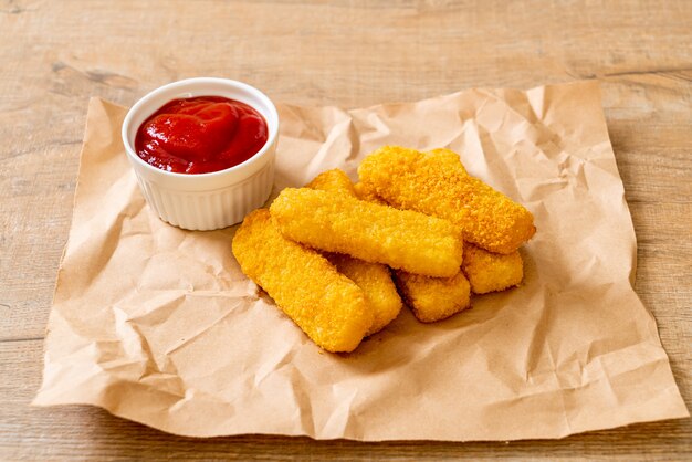 crispy fried fish fingers with ketchup