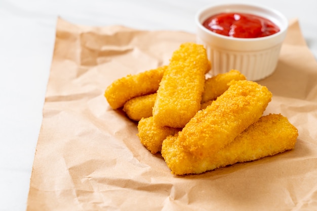 Crispy fried fish fingers with ketchup