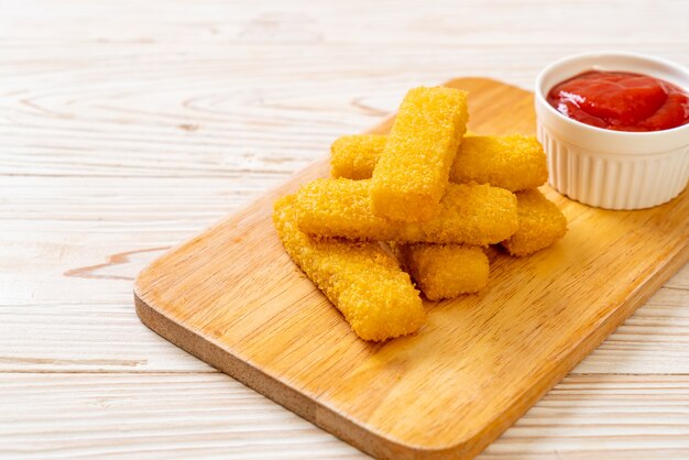 Crispy fried fish fingers with ketchup