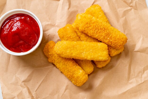 crispy fried fish fingers with ketchup