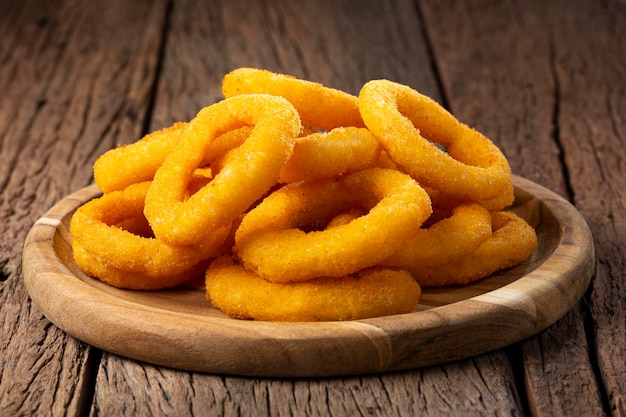 Crispy fried onion rings on the table.