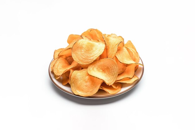 Crispy fried potato chips on a plate isolated on a white background