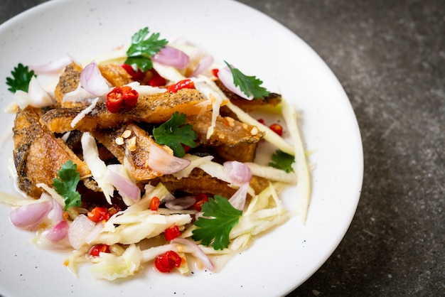 crispy gourami fish with spicy salad