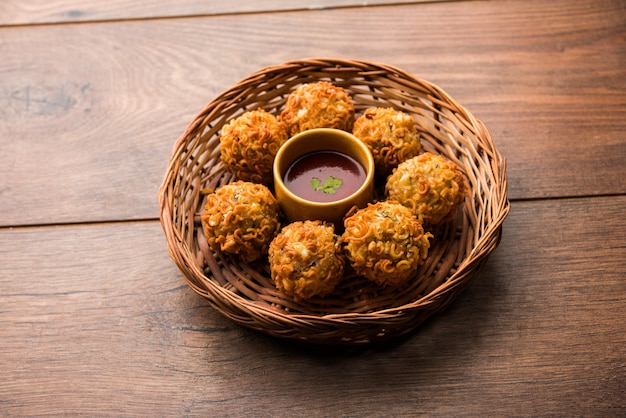 Crispy Noodles Pakora or pakoda is a popular indo-chinese street food served with ketchup