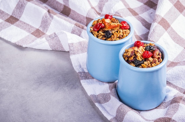 Crispy oatmeal muesli in jars