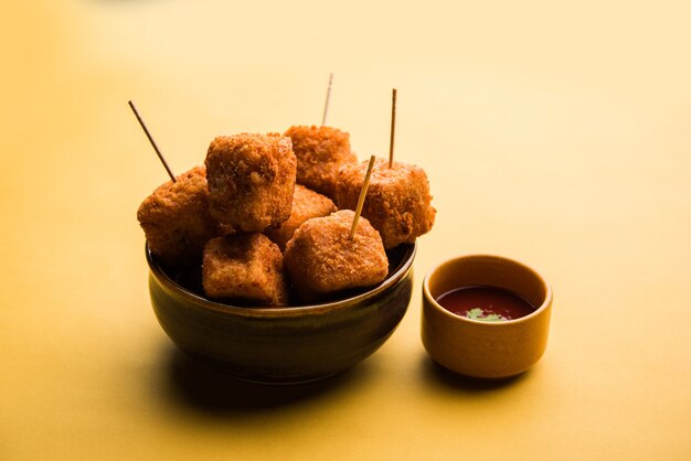 Crispy Paneer popcorn is a popular party snack and an appetiser. selective focus