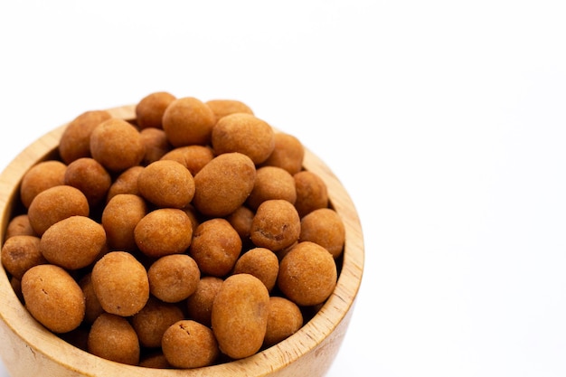 Crispy peanut snack balls on white background.