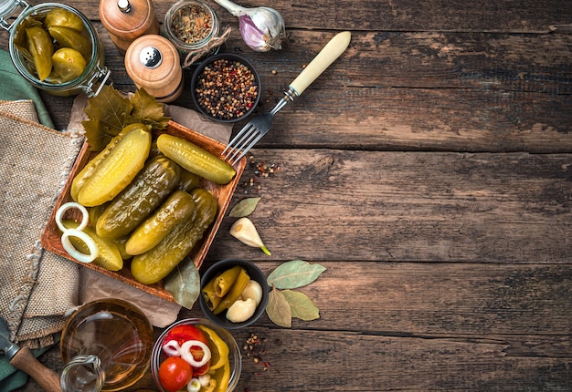 Crispy pickled cucumbers on a wooden table