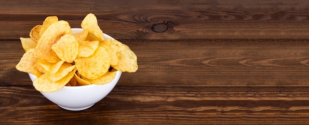 Crispy potato chips in bowl