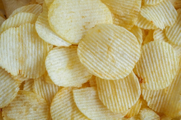 Crispy potato chips snack texture background