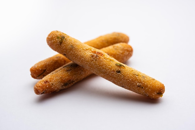 Crispy Rava Aloo fingers or Potato semolina fried finger sticks served with ketchup