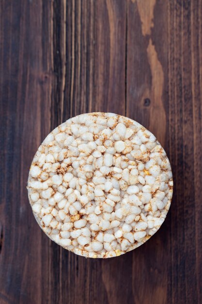 Crispy rice diet toasts on brown wooden surface