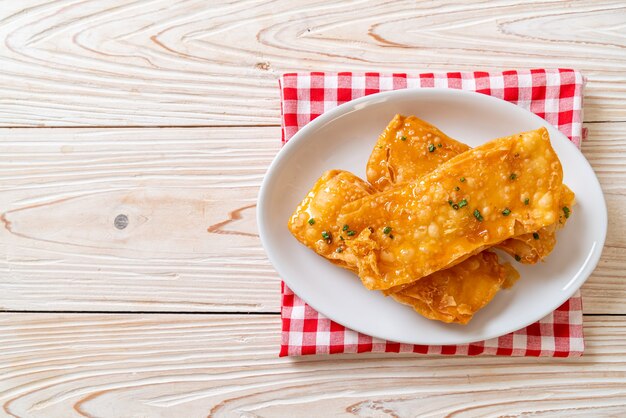 crispy roti with sugar on plate