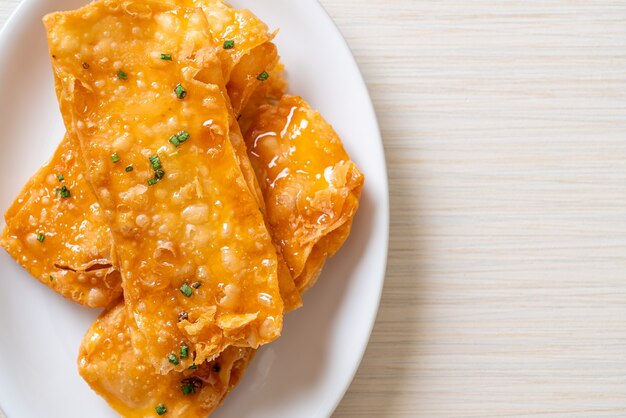 crispy roti with sugar on plate