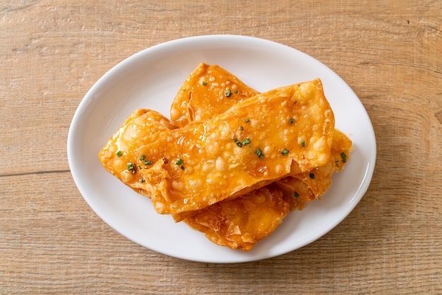 crispy roti with sugar on plate