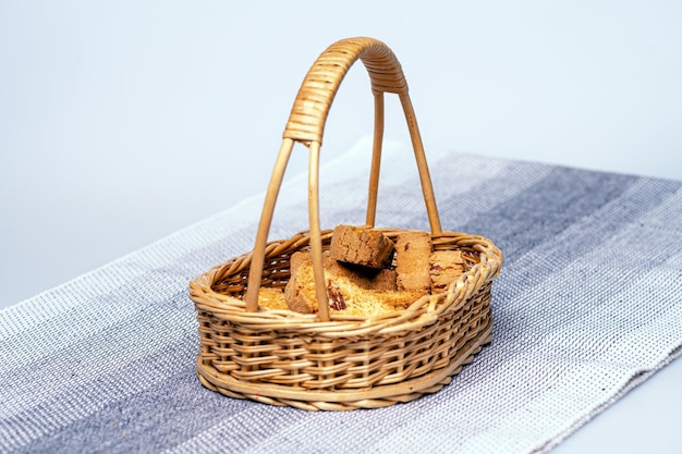 Crispy rusk or toast in a basket on the table closeup