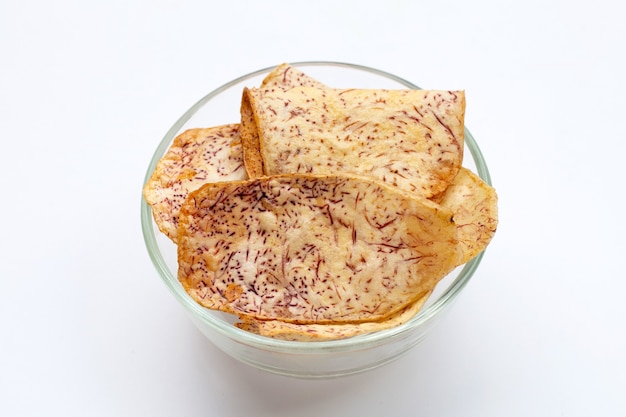 Crispy taro chips in glass bowl.