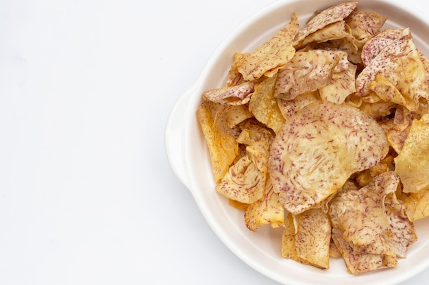 Crispy taro chips on white background