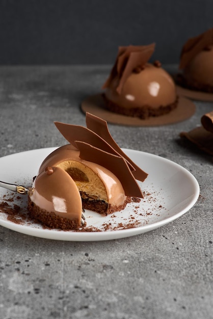Crispy tart with delicate chocolate mousse and salted caramel Copy space for text