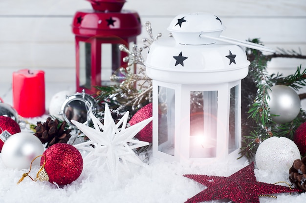 Cristmas lantern with decorations and snow