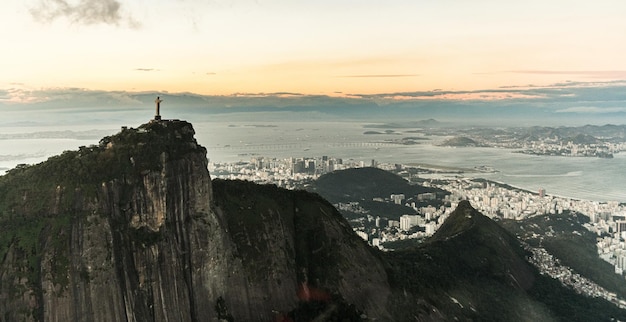 Cristo Redentor statue in Rio de Janeiro aerial shot during a spectacular sunset