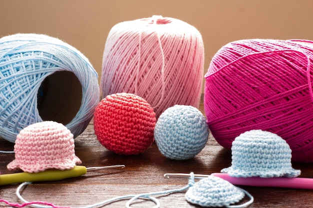 Crochet. Balls of colored yarn on wood table