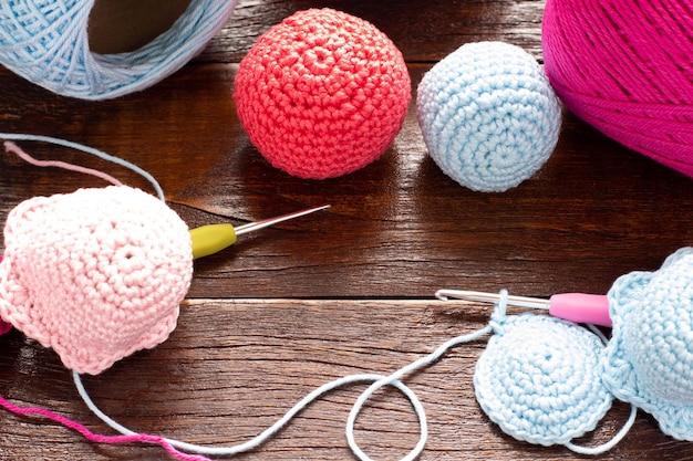 Crochet. Balls of colored yarn on wood table