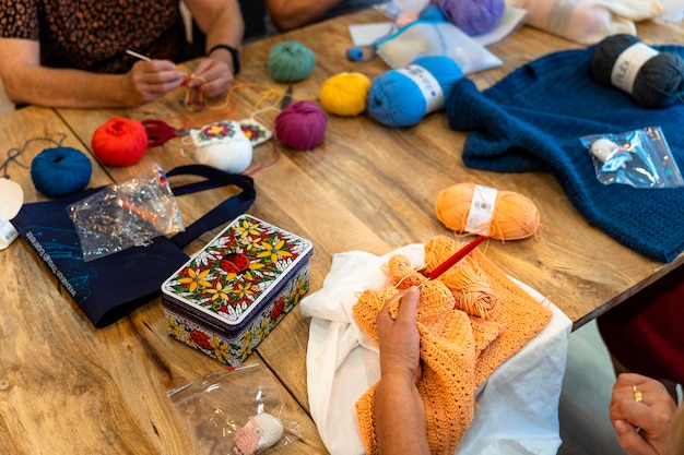 Crochet club Ladies crocheting with colored wool