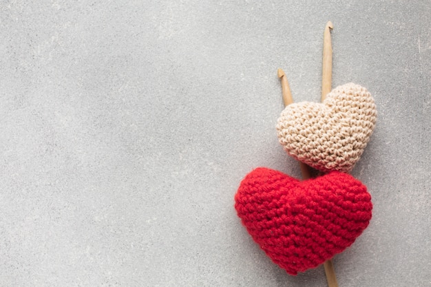 Crocheted heart shapes with copy space background