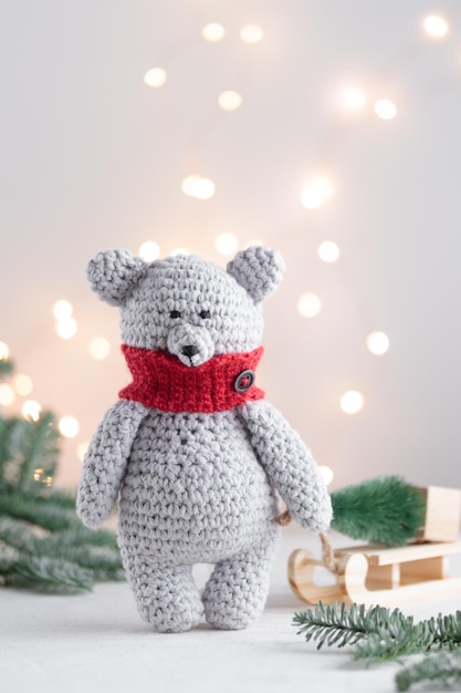 Crocheted white bear with the Christmas tree