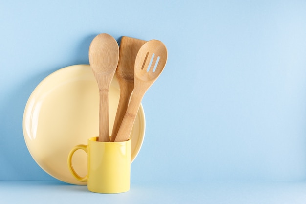 Crockery and cutlery on a blue pastel.